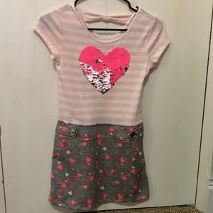 Girls mini dress with reversible heart sequence design.